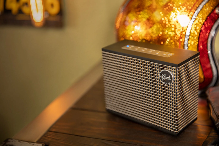 A refined living room setting highlighting Klipsch Heritage Groove speakers, blending classic audio design with modern decor and warm accent lighting.