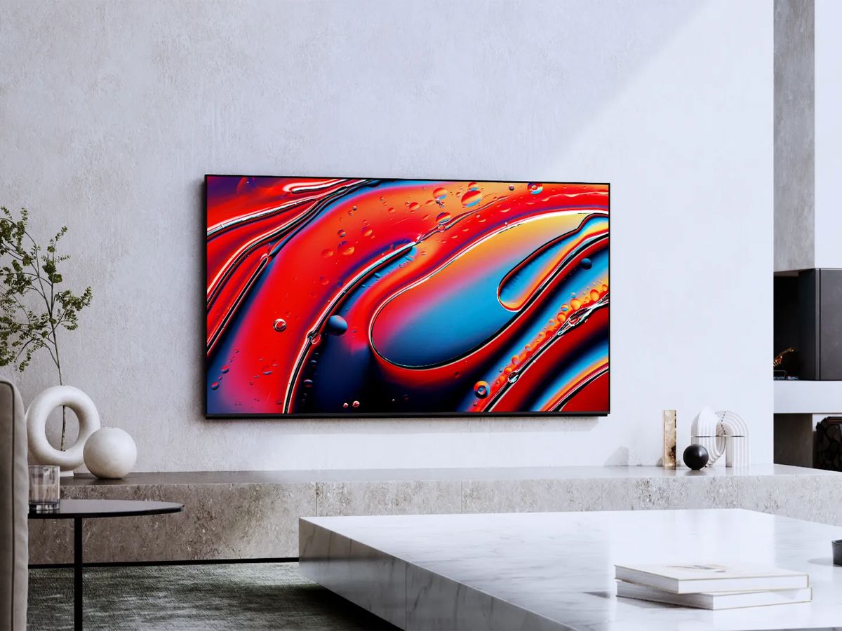 Control4 Touch panel in a able with a traditional home in the background